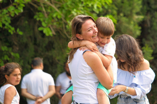 The child and mother hugged each other happily.